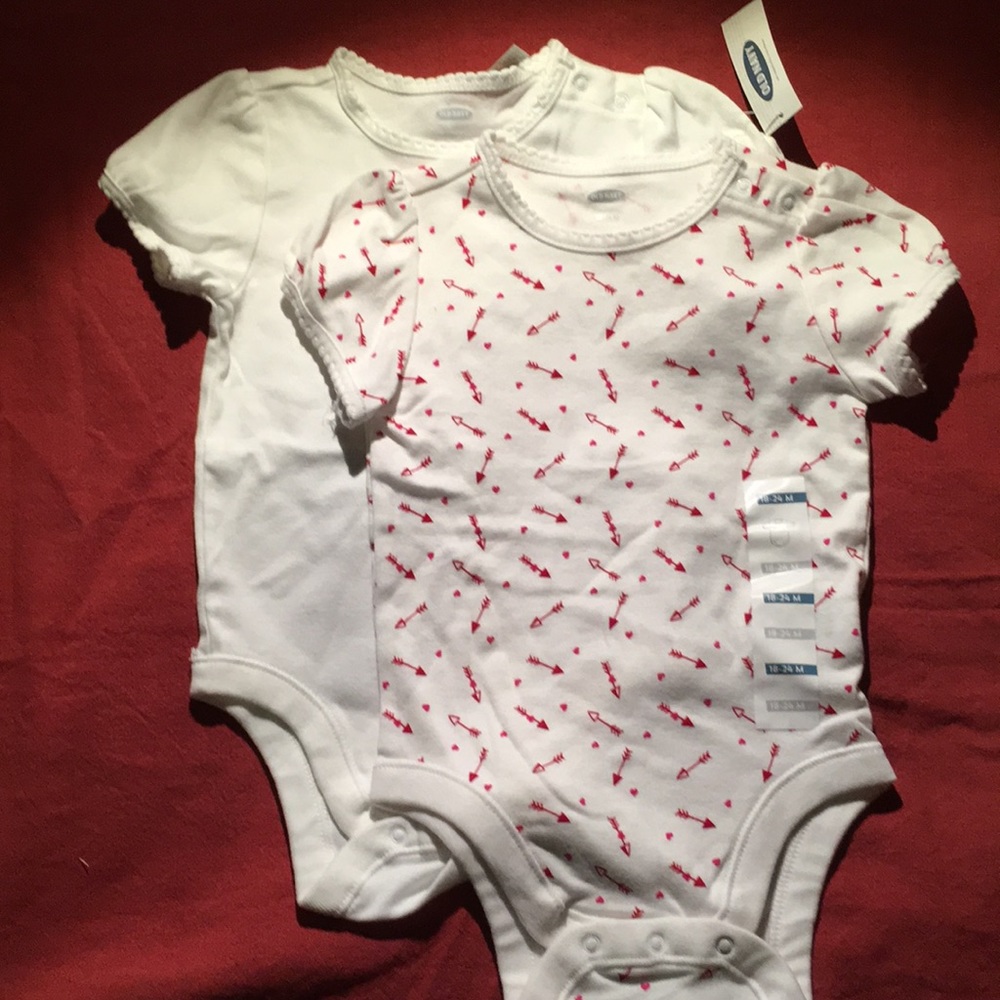 2 old navy onesies,1 white, 1 hearts and arrows